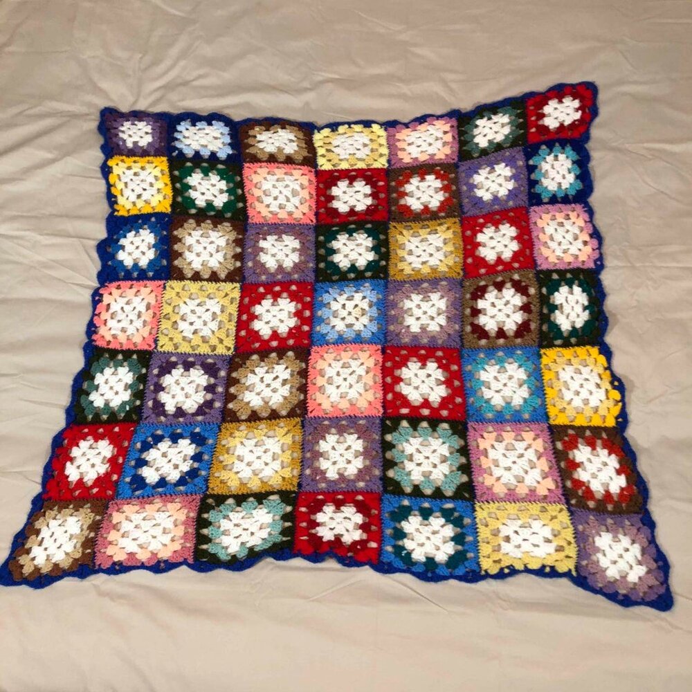 Vintage multicolored crochet afghan - blue border w/ granny core squares
